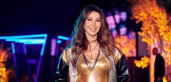 مذيع يخيّر نانسي عجرم بين زوجها وأولادها وردّها ناري