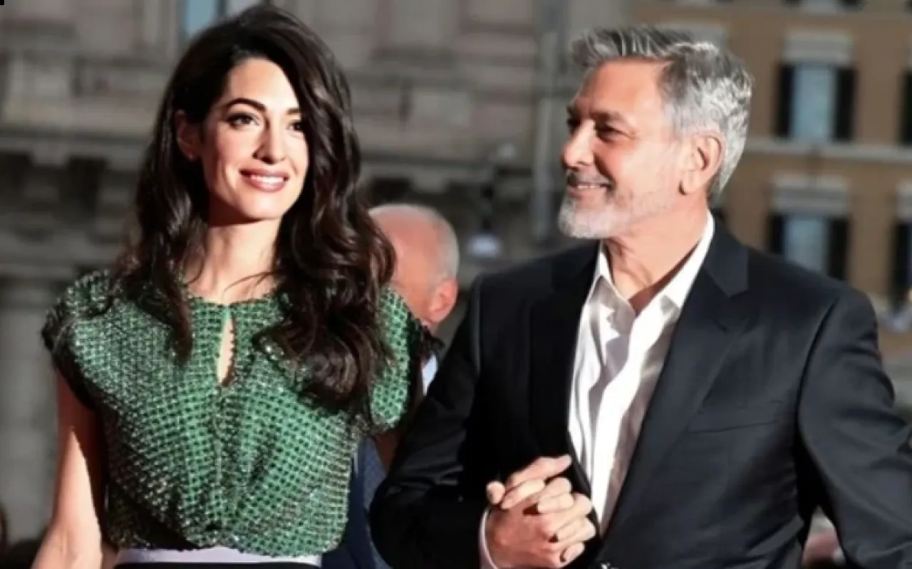 زوجة جورج كلوني مهددة بالمنع من السفر للولايات المتحدة ما القصة