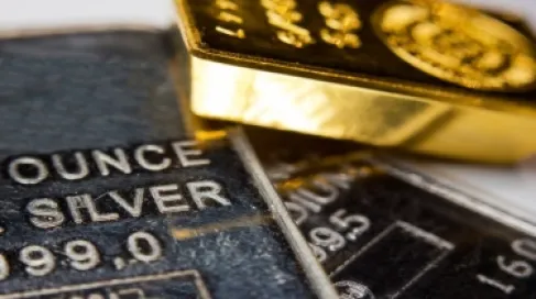 Gold retreats 0.4% and silver drops after surpassing $80 per ounce