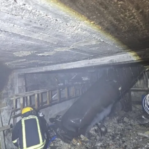 Shrapnel from a missile destroys a three-story house and ignites a massive fire in the West Bank