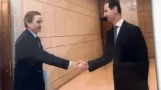 حسام لوقا يصافح بشار الأسد