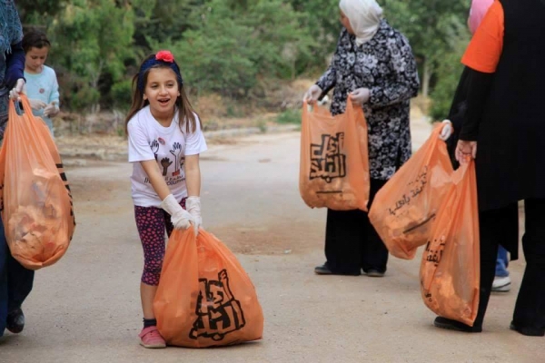 حملة تنظيف في غابة المدينة الرياضية - صور